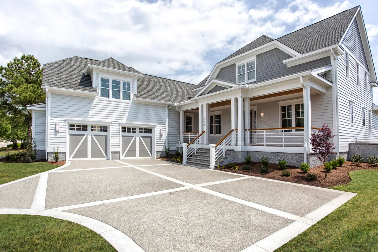 Clopay Coachman doors on a gray farmhouse
