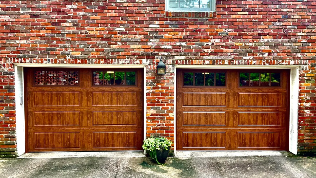 A pair of stained carriage doors on brick